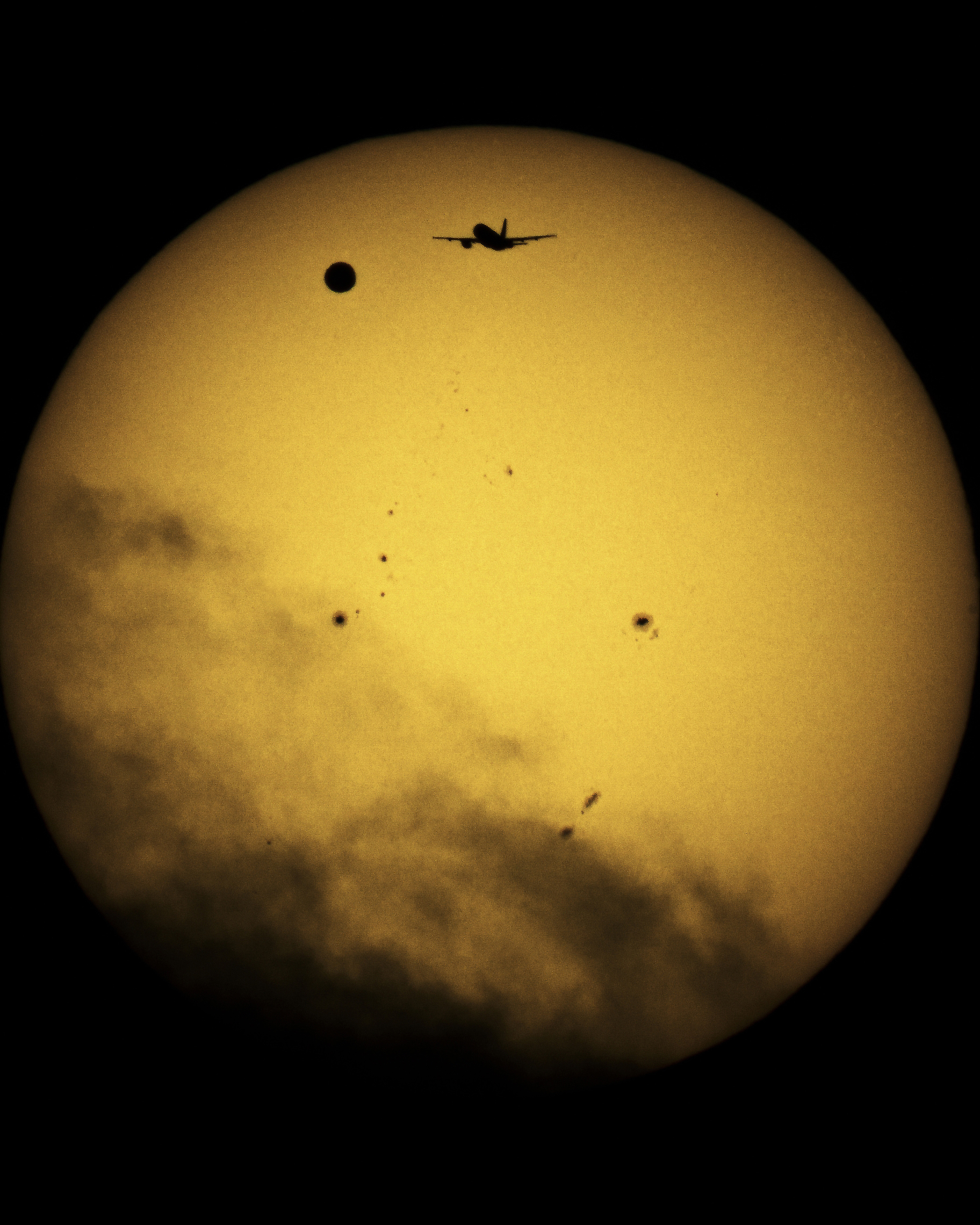 Venus and airplane with Sun in background