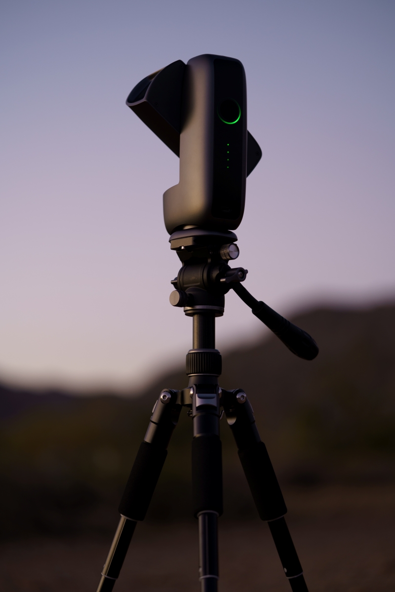 Life style photo of the DWARF Mini smart telescope during sunset